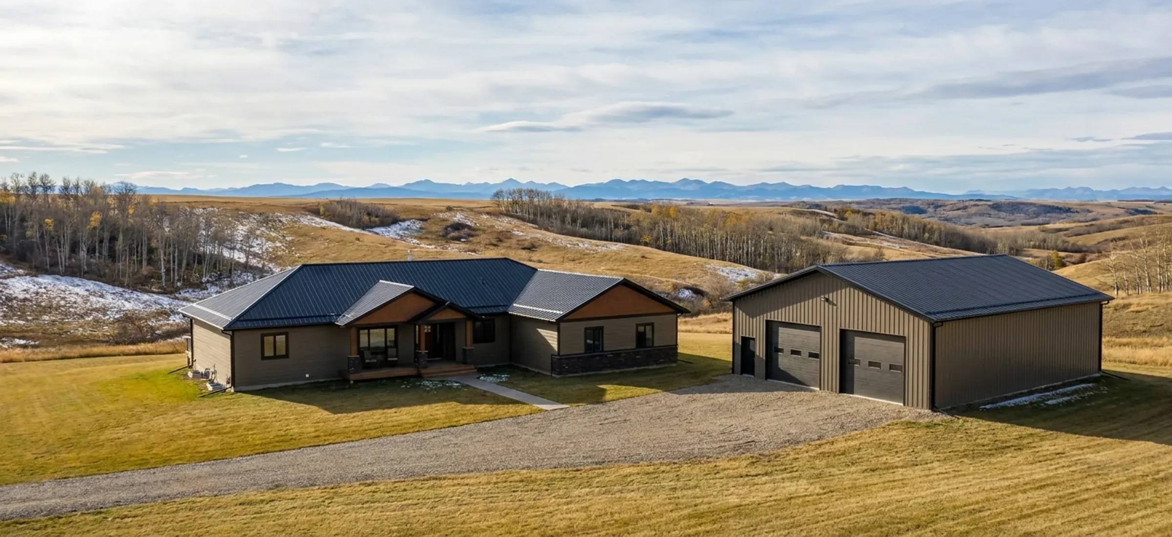 A steel shop finished in colours matching the house beside it on a country-residential acreage